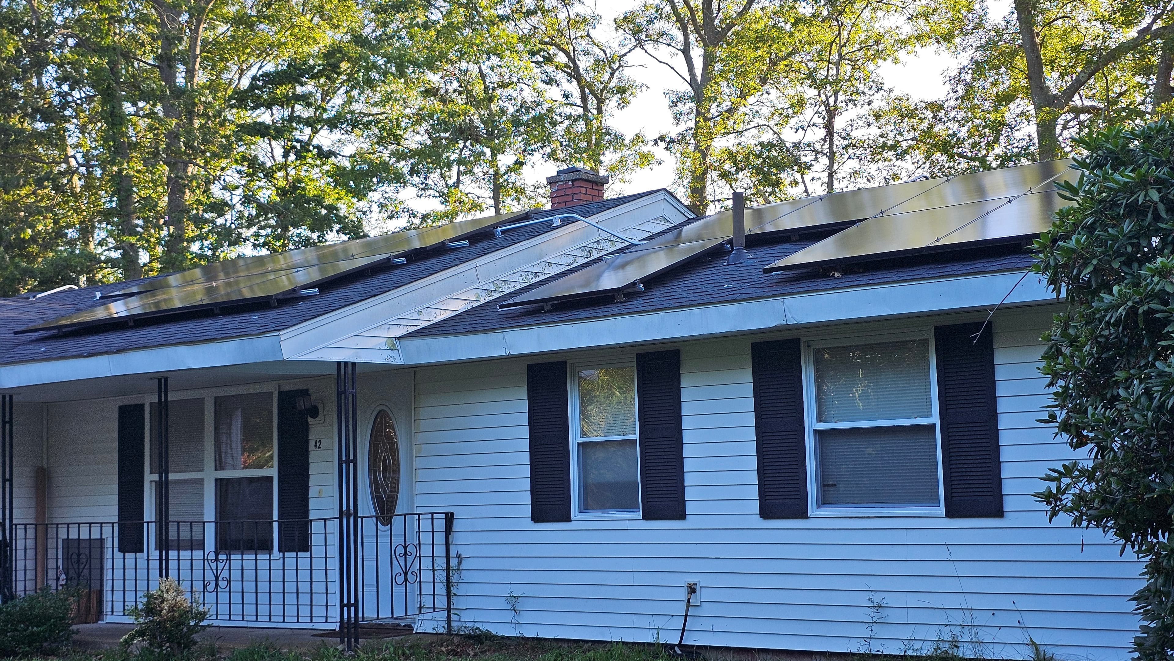 Solar panels installed on residential roof replacement in Massachusetts